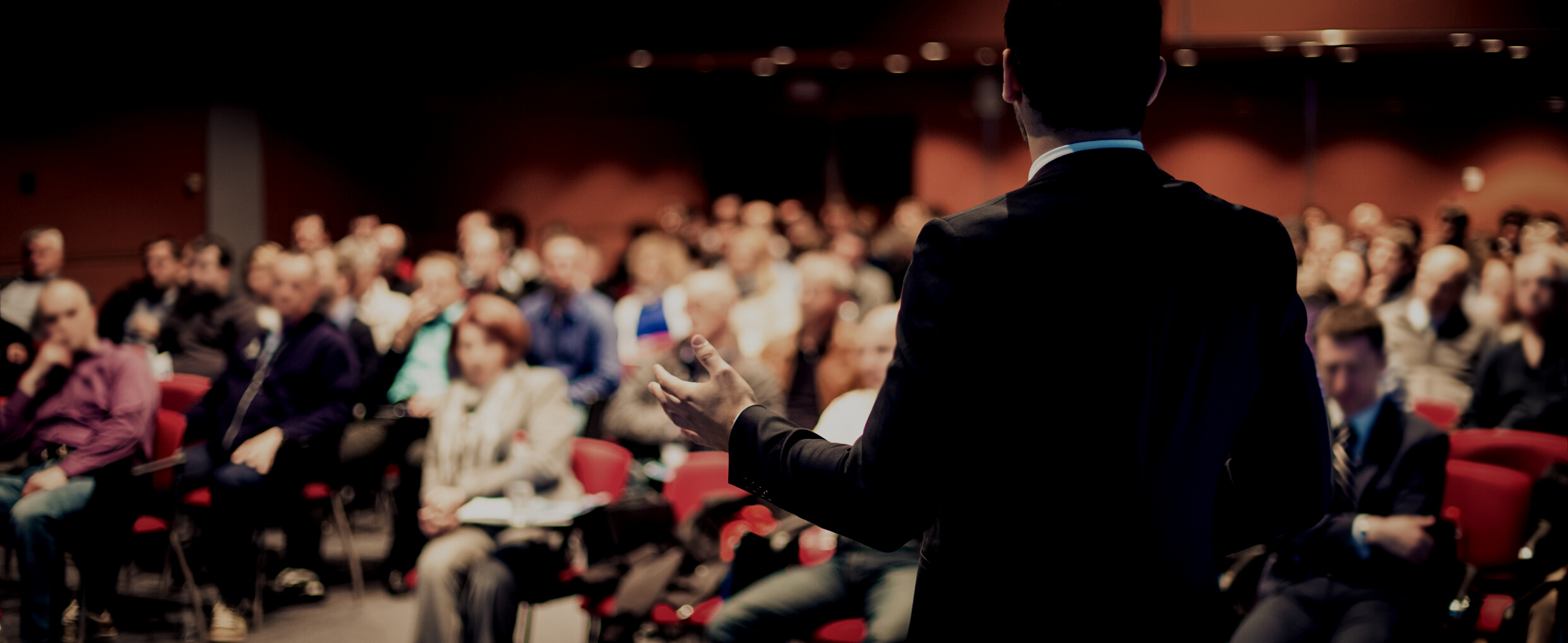 Speaker Giving a Talk in Conference Hall at Event